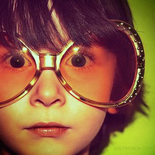 David Graphistolage shoots anything and everything, including small children in huge glasses