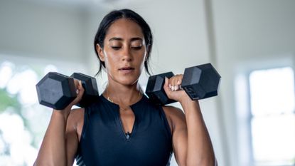 Woman working out with dumbbells