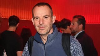 Martin Lewis wearing a backpack