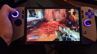 The MSI Claw 8 AI+ running Doom 2016, with a cheeky pentagram on screen.