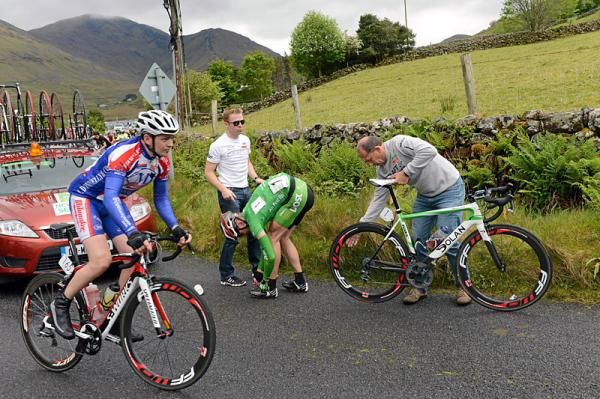 Gediminas Bagdonas (An Post-Sean Kelly) changes his shoes following a crash on the on the appraoch to Tourmakeady.