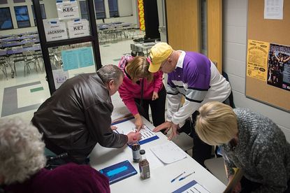 Iowa voters check in.