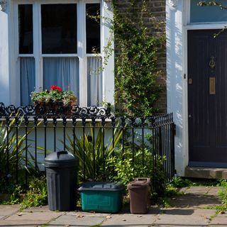 house with grey door brick walls and white window