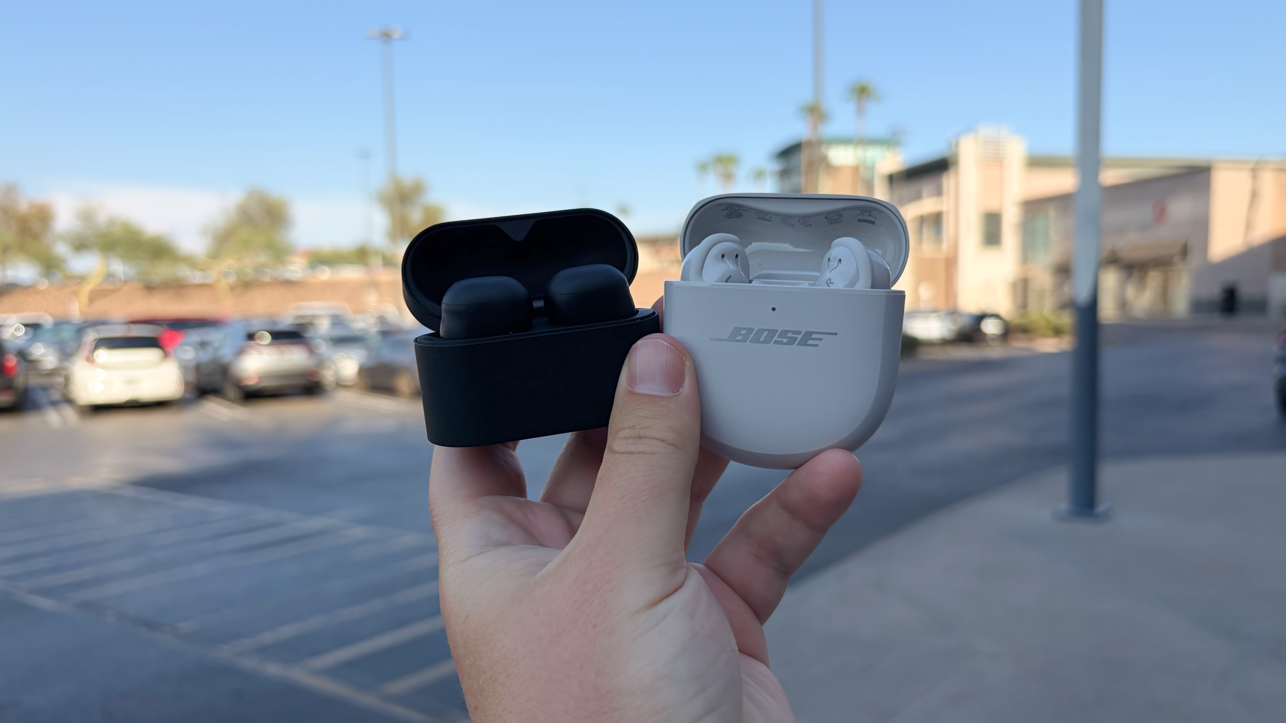 The Sony WF-1000XM6 and the Bose QuietComfort Ultra Earbuds at a mall.