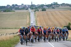 The Tour de France Femmes peloton ride through the French countryside during stage five of the 2022 race