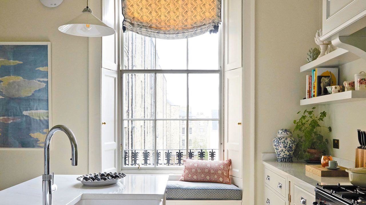 kitchen window seat in large kitchen with open shelves and island