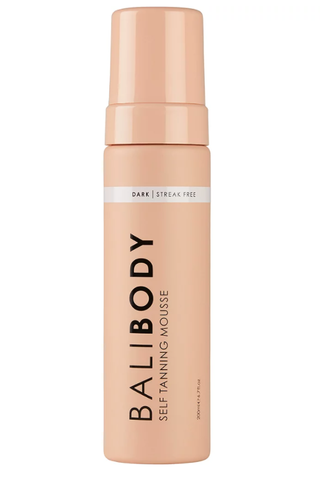 A bottle of BaliBody self tanning mousse set against a white background.