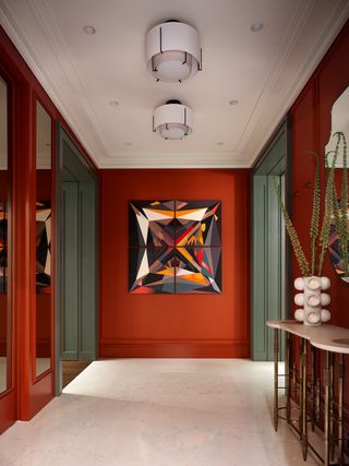A red entryway with statement art