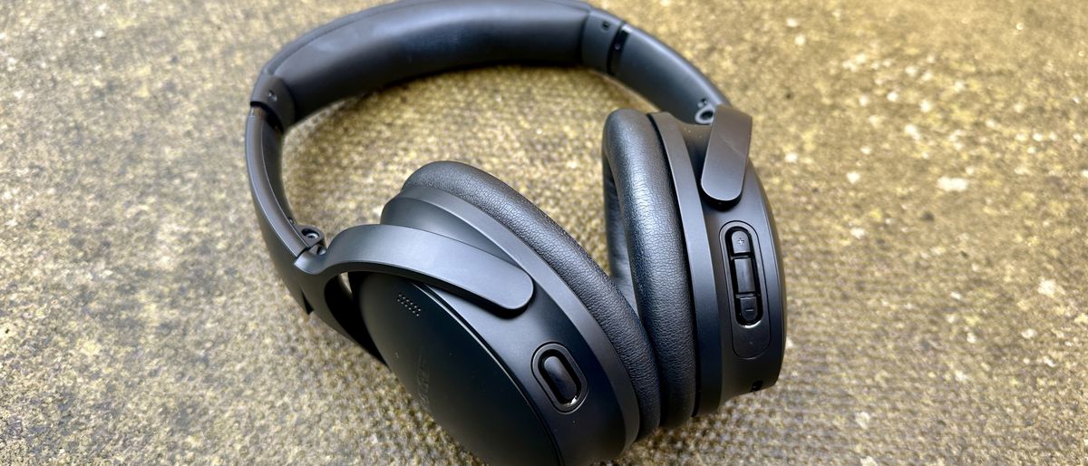 The Bose QuietComfort headphones pictured on concrete