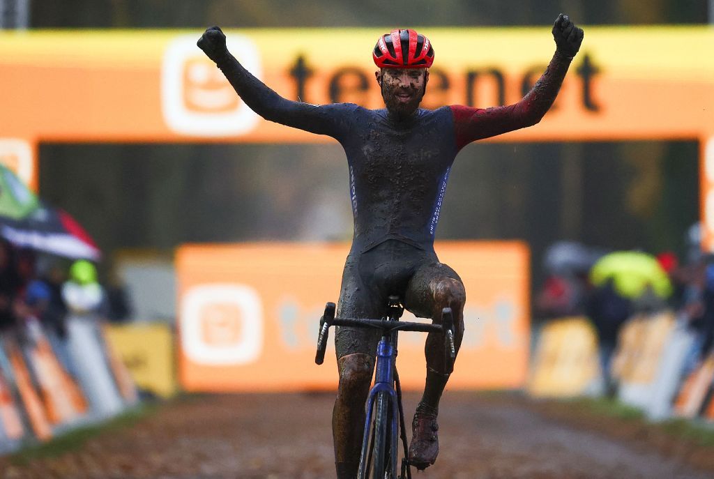 Dutch Joris Nieuwenhuis celebrates as he crosses the finish line to win the mens race of the Aardbeiencross cyclocross event fourth stage 48 of the Superprestige cyclocross cycling competition in Merksplas on November 18 2023 Photo by DAVID PINTENS Belga AFP Belgium OUT Photo by DAVID PINTENSBelgaAFP via Getty Images