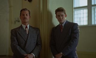 guy pearce and joe alwyn as the van buren family in a still from the movie the brutalist