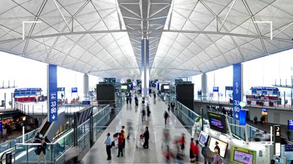 People in Hong Kong International Airport to illustrate a feature on airport anxiety