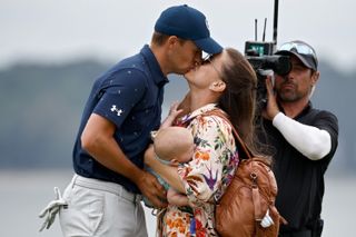 Spieth kisses his wife