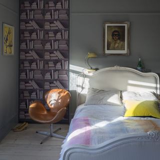 bedroom with grey walls and wooden flooring