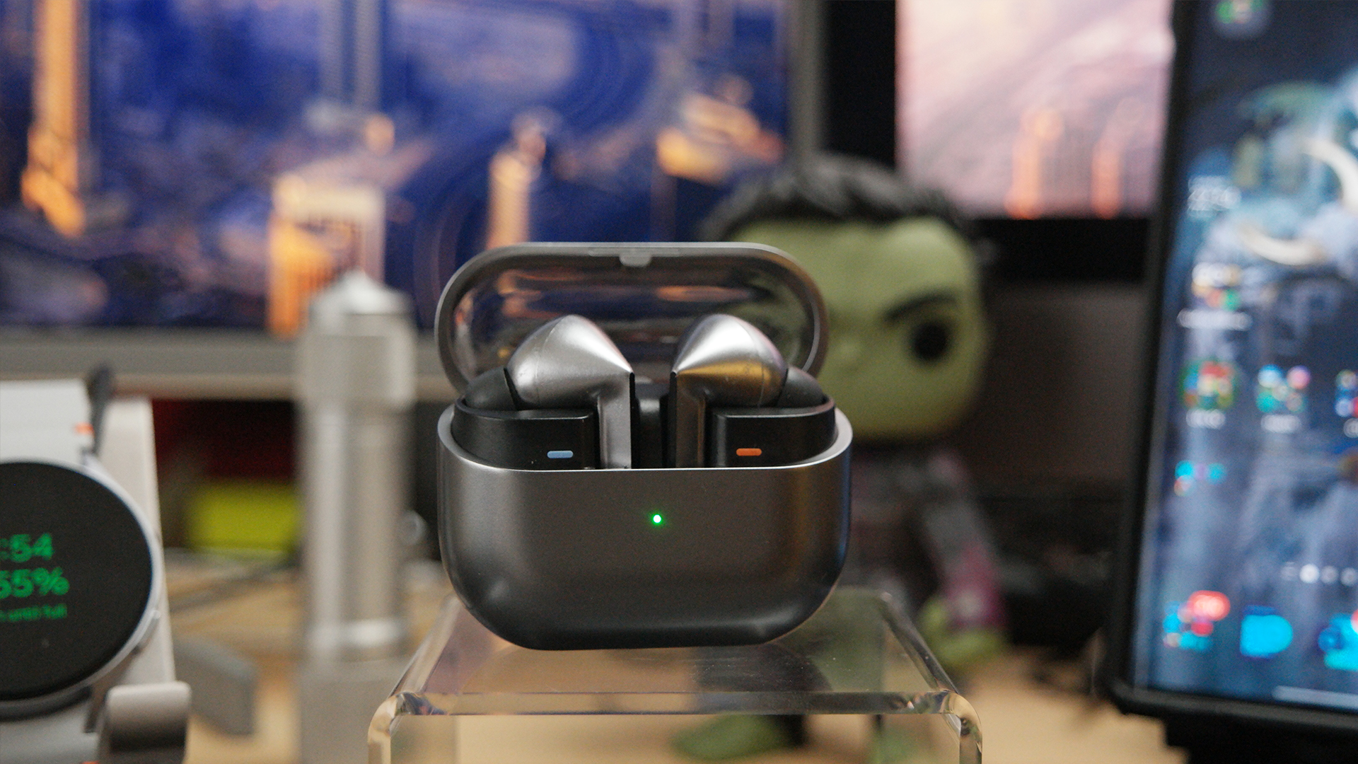 Galaxy Buds 3 Pro on a desk with the lid open