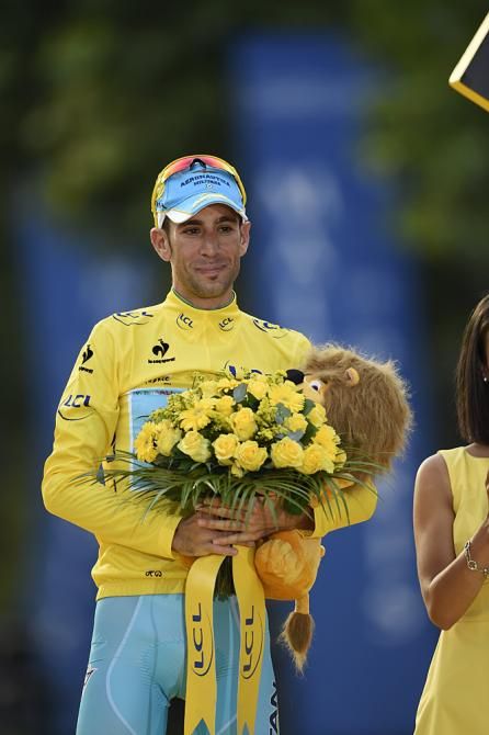 Vincenzo Nibali (Astana) holds his bouquet on the final podium