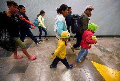 A group of Central American migrants heading in a caravan to the US, walks at the metro in Mexico City, on their way to Queretaro state, on November 9, 2018.