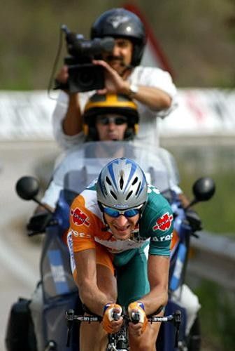 Denis Menchov (Rabobank) pursued by a TV moto
