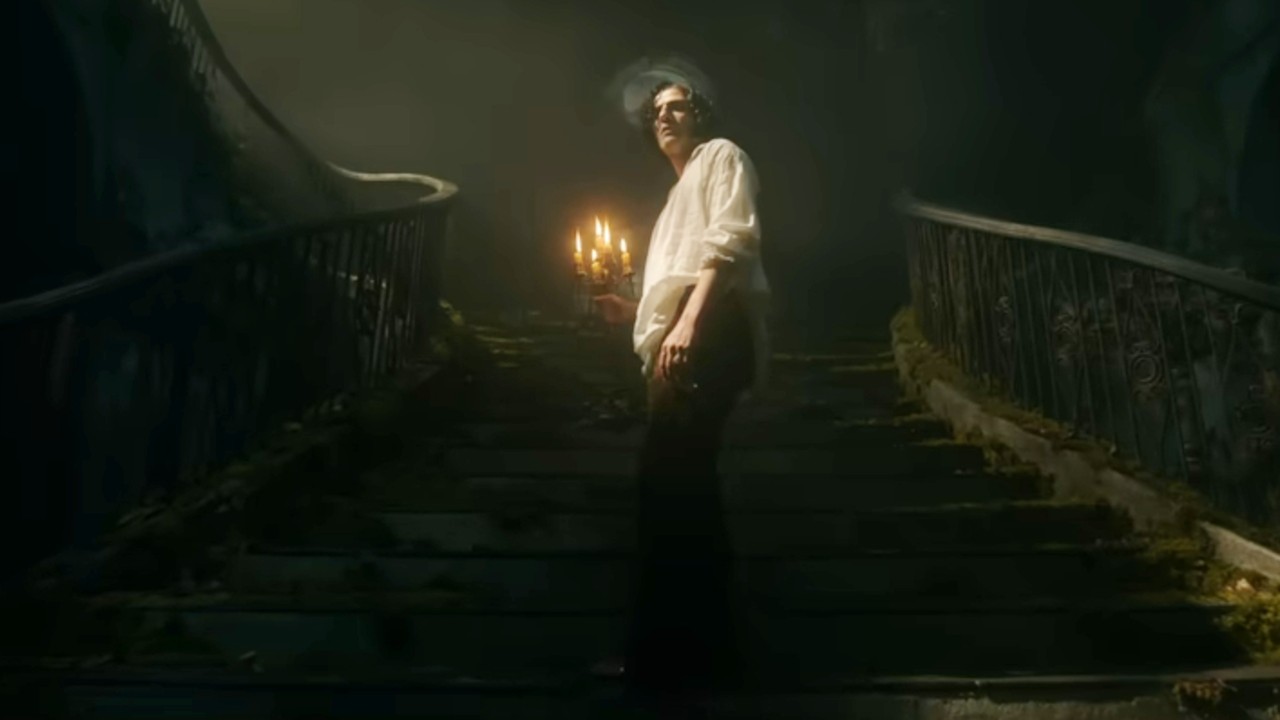 Oscar Isaac with a candle in Frankenstein.