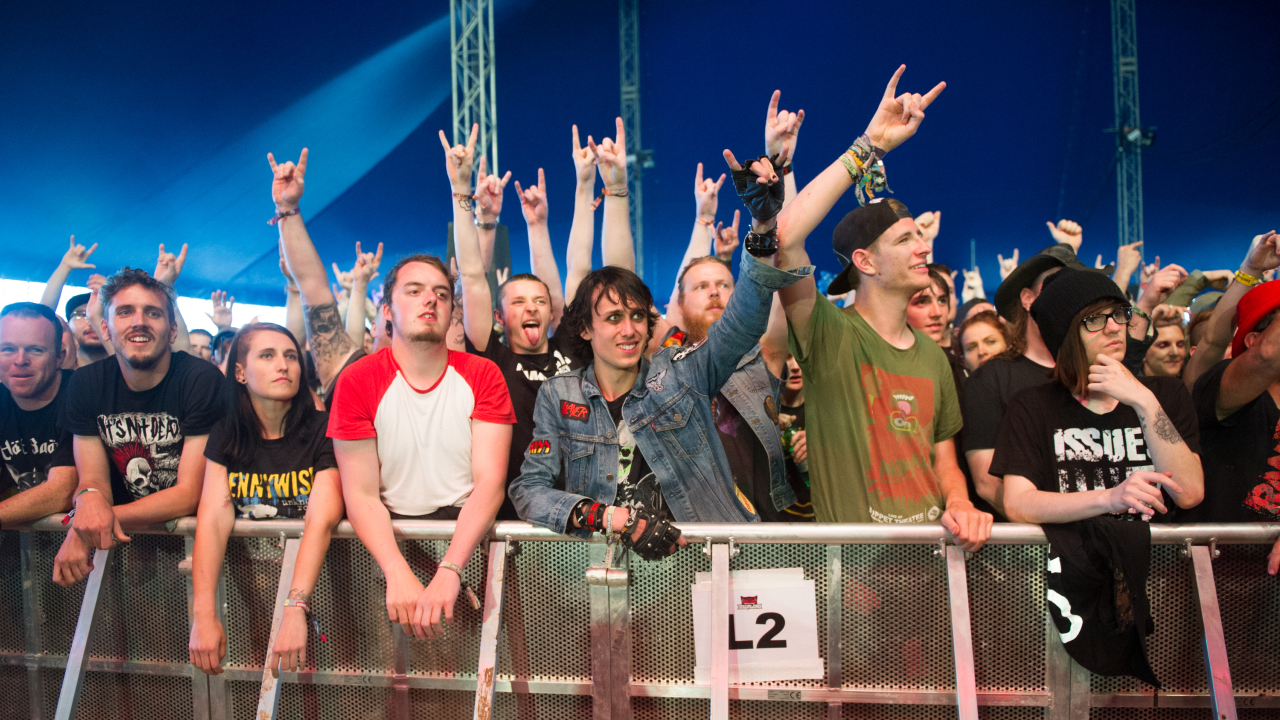 Audience raising the sign of the horns at Download Festival in 2016