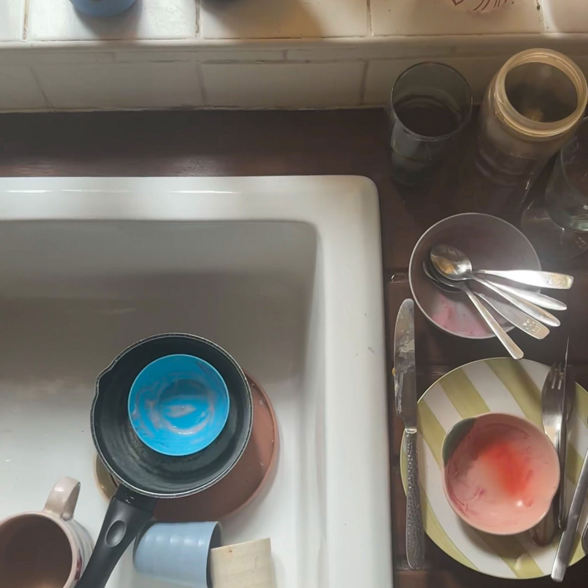 Kitchen sink with washing up in it