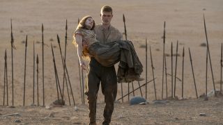 Rand carrying Moiraine out of Rhuidean in The Wheel of Time season 3