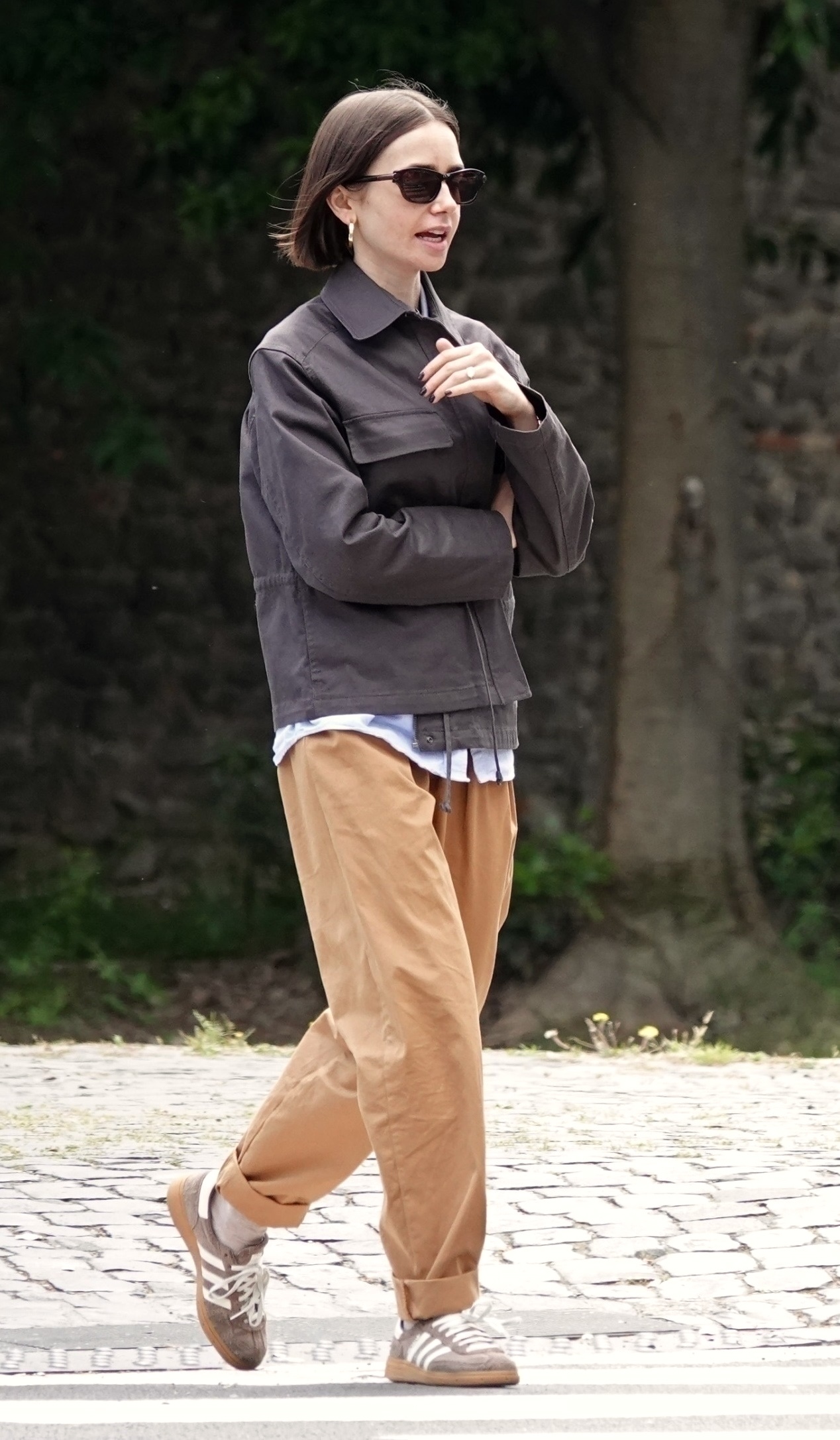 American actress Lily Collins takes a break from filming 'Emily in Paris' and enjoys a stroll