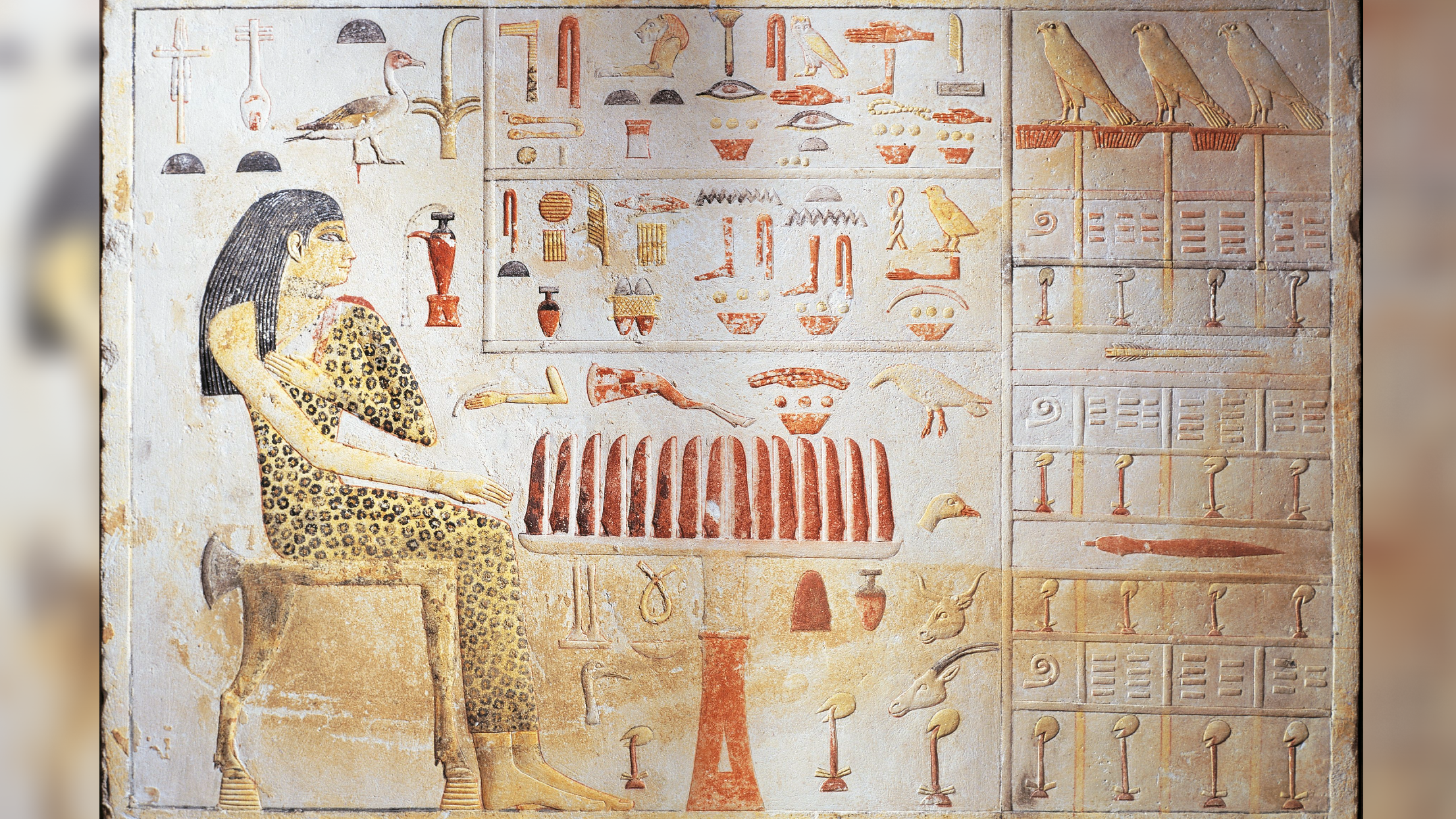slab stela from ancient Egypt depicting a princess at a funeral feast