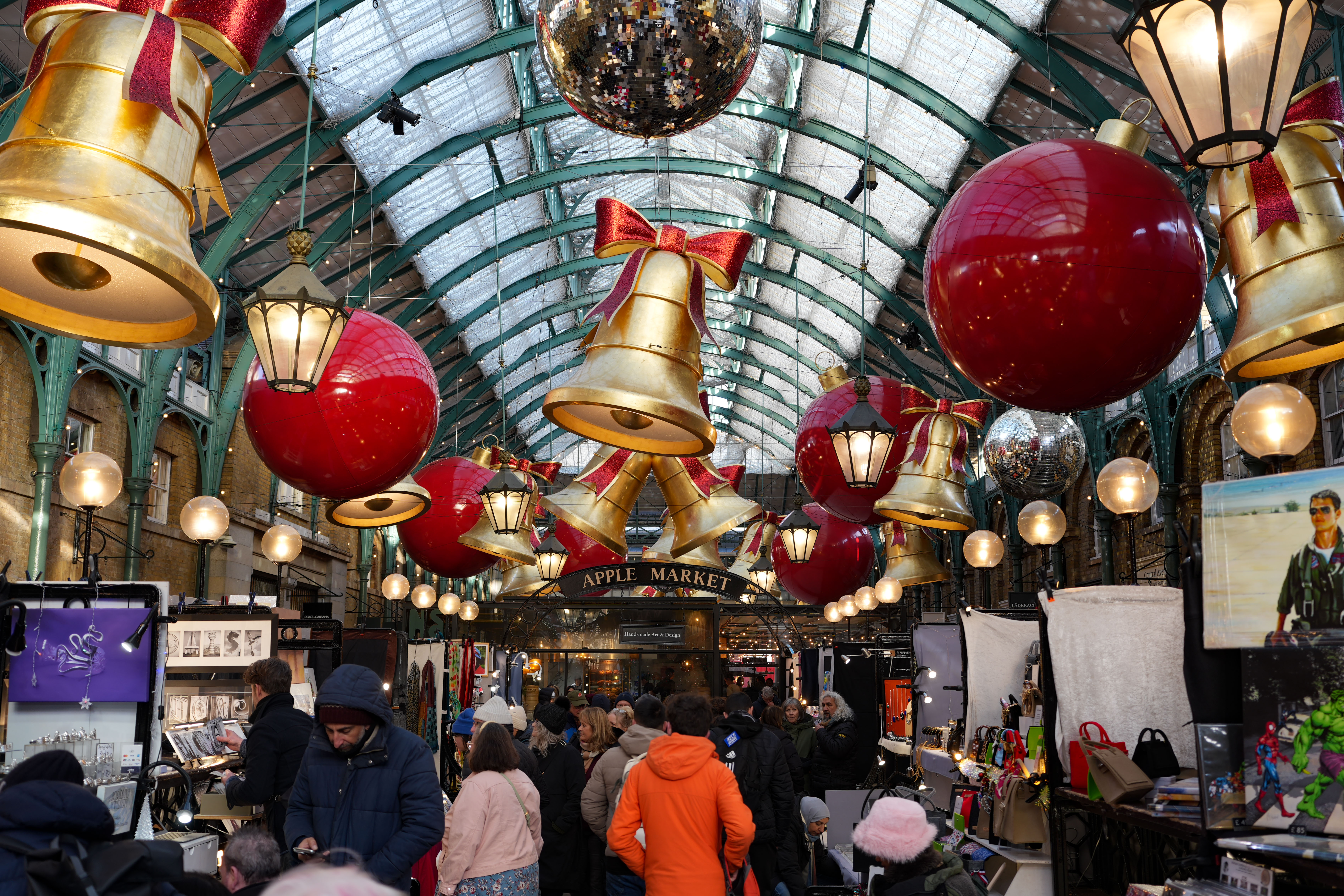 Christmas decorations up above an art market in Covent Garden