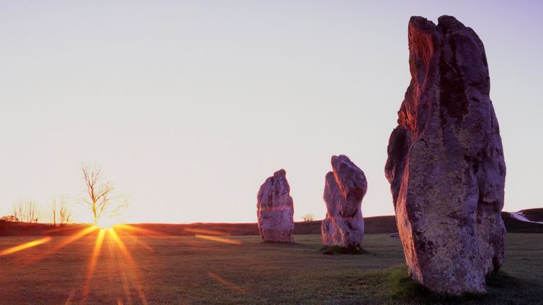 Spring Equinox 2022—Standing Stones at Avebury at sunrise on the Vernal (Spring) Equinox, designated a UNESCO World Heritage Site, the purpose of the ancient obelisks remains an enigma.