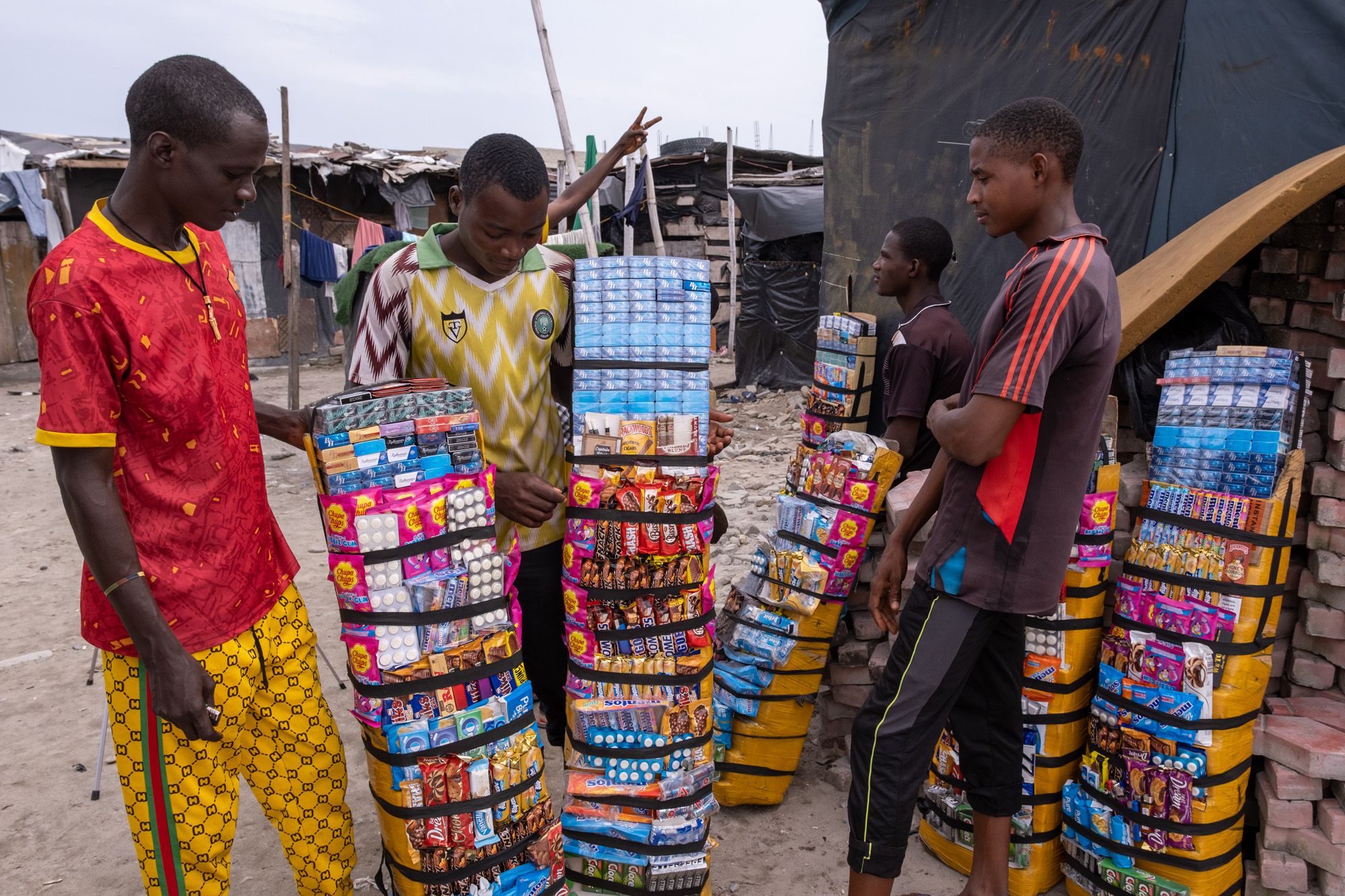 Handheld selling kiosks being carried by a man