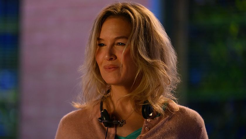 Renee Zellweger smiling with headphones around her neck in Bridget Jones: Mad About The Boy