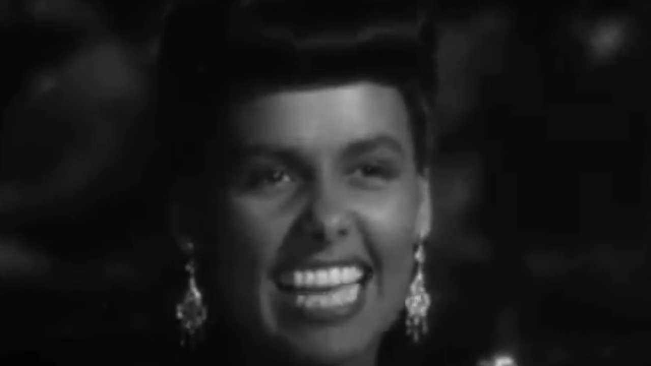 A close up of Lena Horne singing