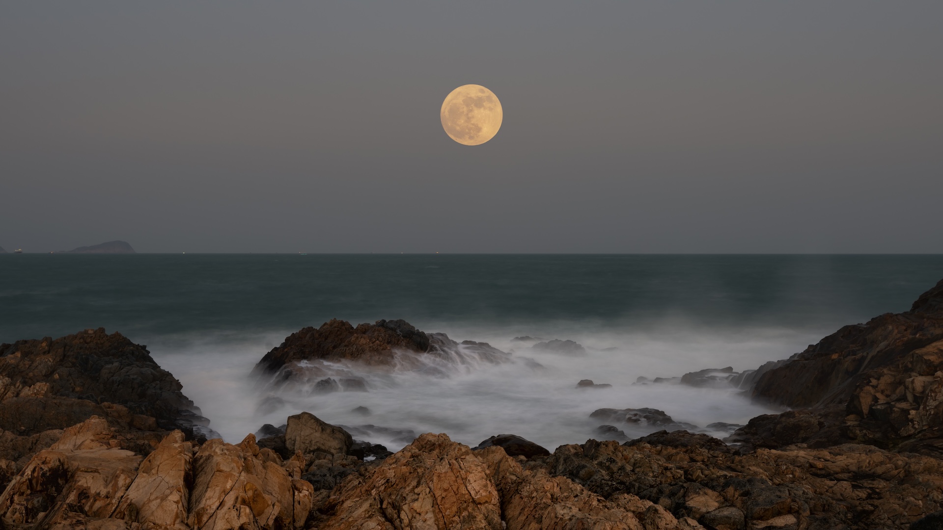 the moon over the ocean