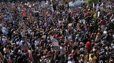 Crowds of people protest police brutality and the death of George Floyd in Brooklyn, New York, on May 30, 2020.