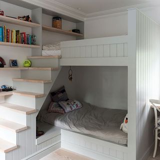 bedroom with bunk bed and open shelves
