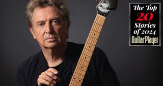 Andy Summers poses with guitar in 2021