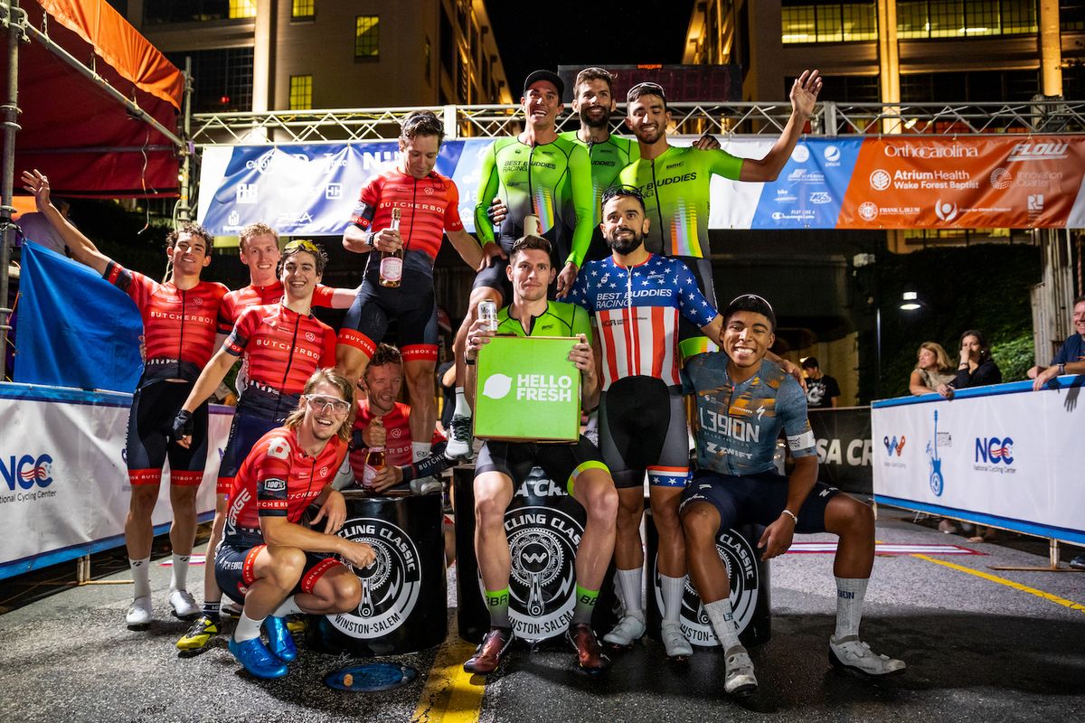 Overall men&#039;s teams for USA CRITS to close out 2021 pose on the podium with the top team Best Buddies Racing in lime green