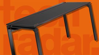 best gaming desk Secretlab Magnus Metal Desk against an orange background 