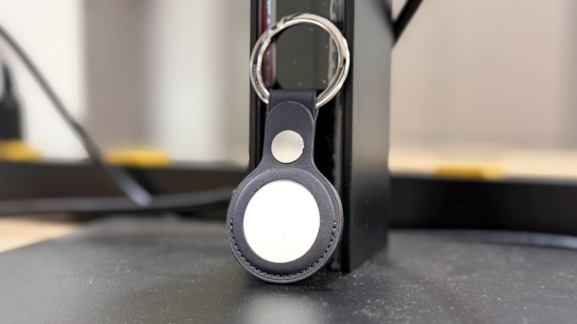 Apple AirTag 2 in keychain holder.