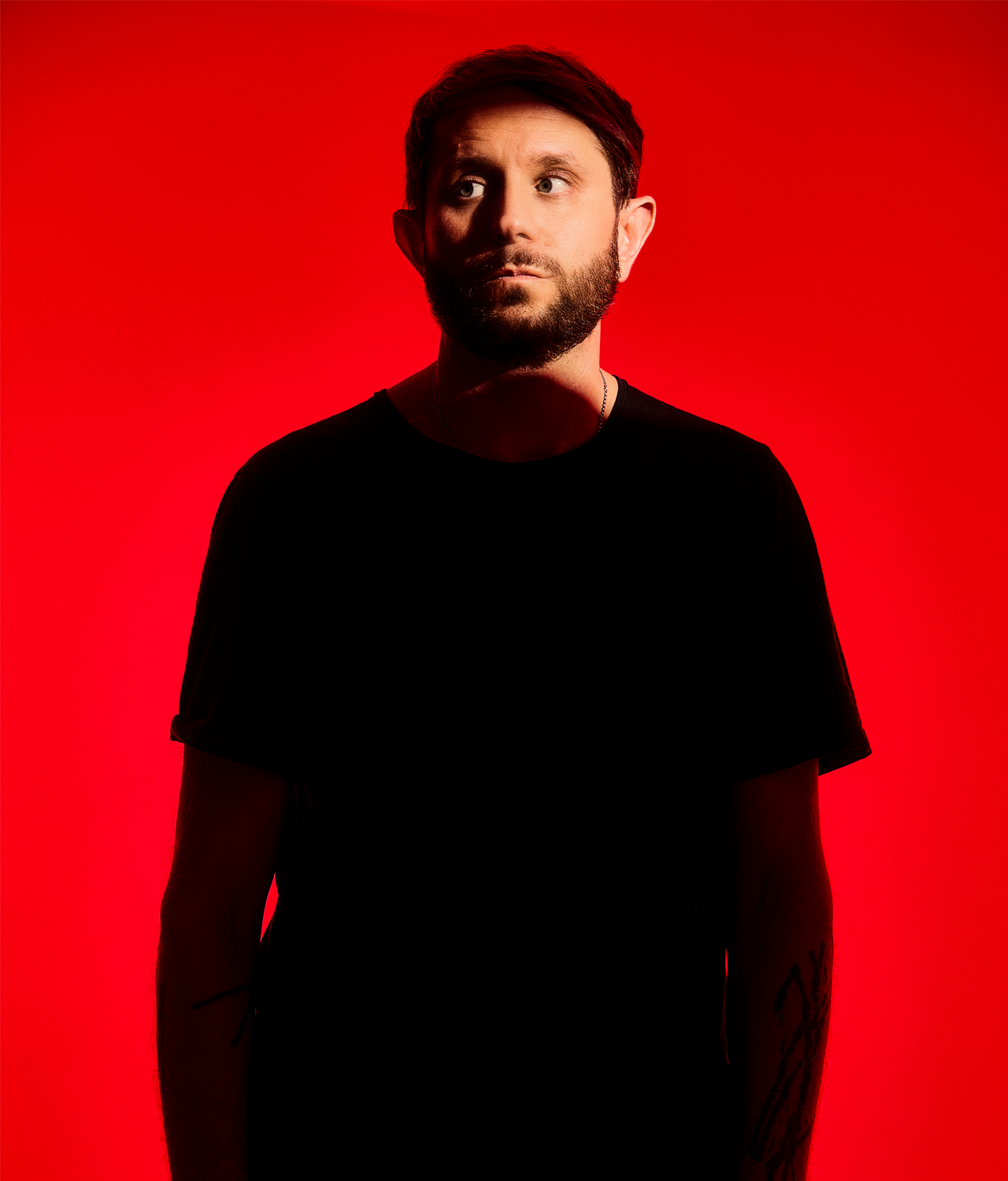 Members of Health shot against a stark red background