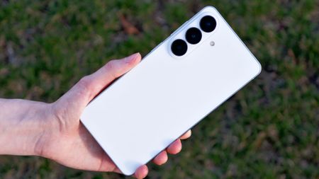 The back of the Samsung Galaxy S26 Plus against grass.