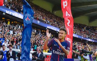 Neymar gestures to the PSG fans at his official presentation after signing from Barcelona in 2017.