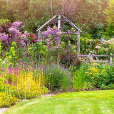 Cottage garden with mixed border planting and ground cover plants