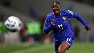 Kadidiatou Diani chases the ball while playing for France