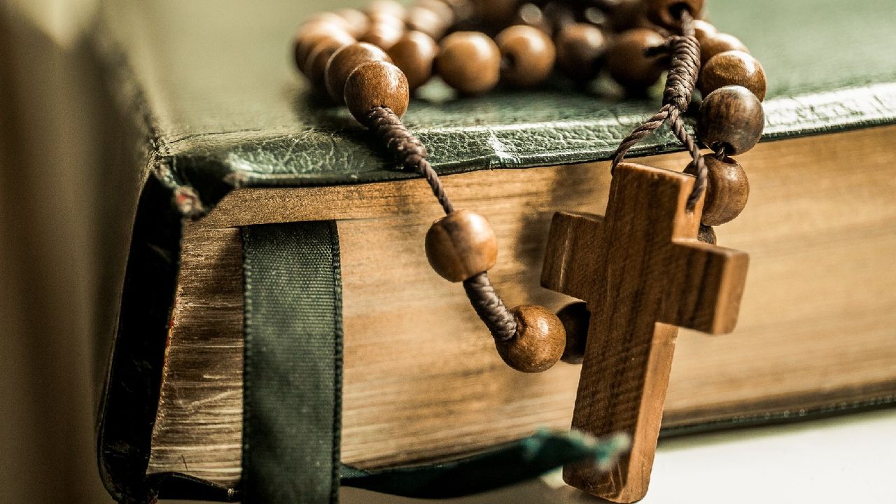 Rosary beads on a bible