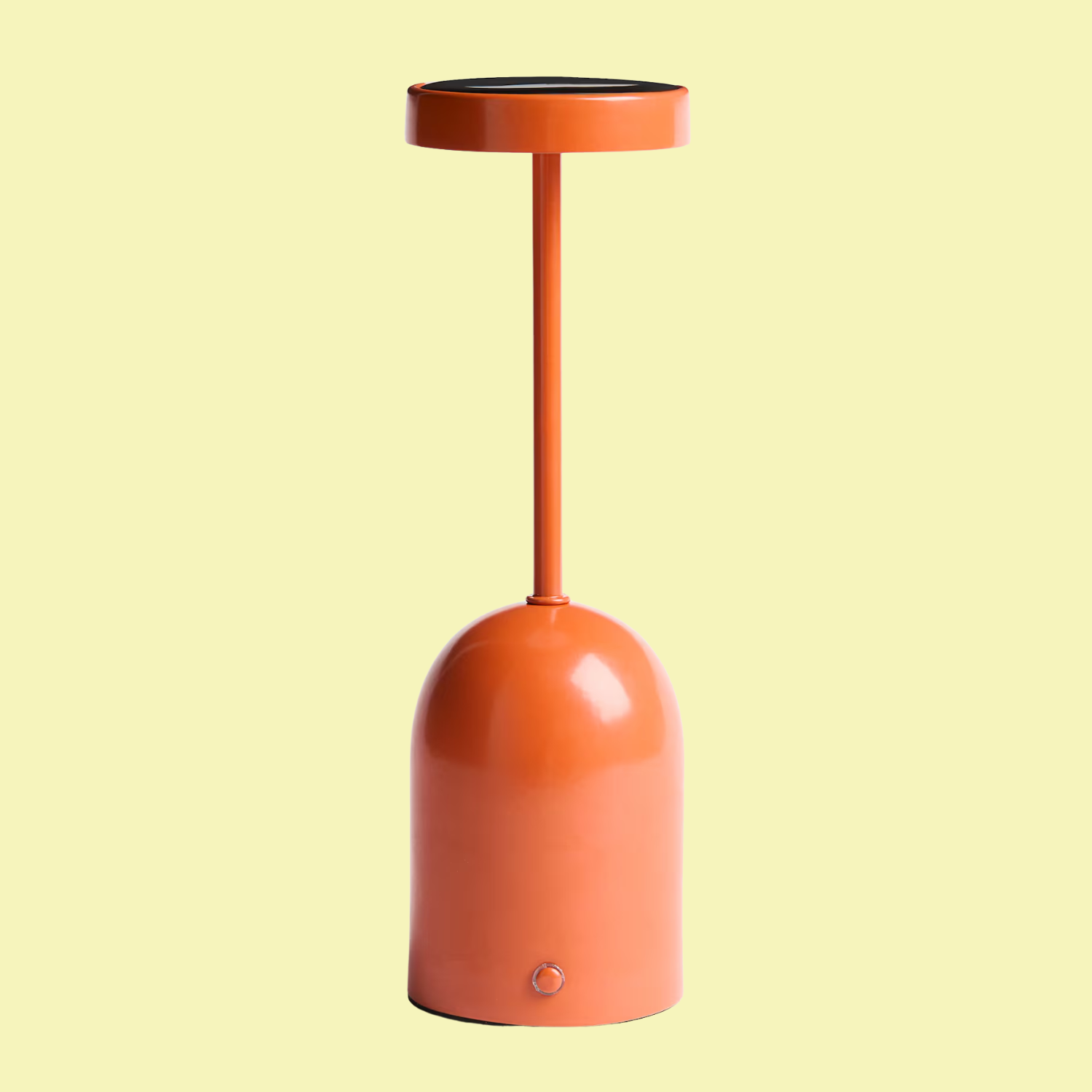A solar-powered orange table lamp