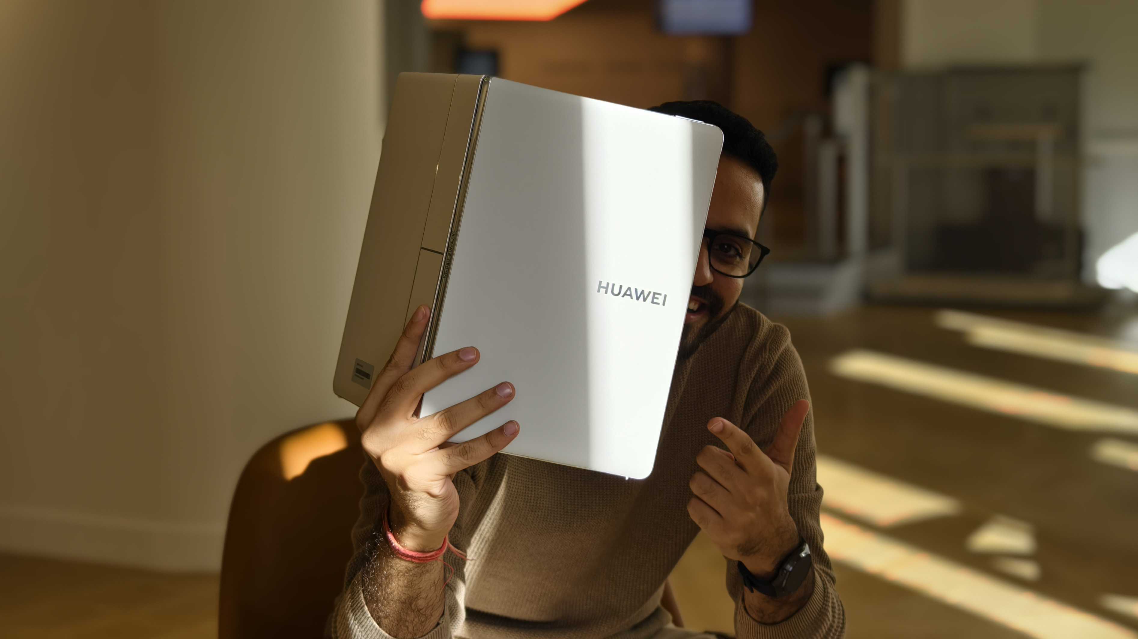 Prakhar Khanna holding the Huawei MateBook Fold.