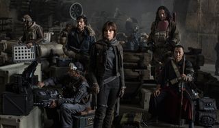 Rogue One: A Star Wars Story Felicity Jones and the cast posing in the middle of Rebel equipment