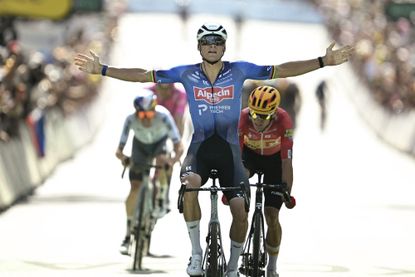 Alpecin - Premier Tech team's Dutch rider Mathieu van der Poel cycles to the finish line to win the 9th stage ahead of Uno-X Mobility team's Norwegian rider Tobias Halland Johannessen during the 113th edition of the Tour de France cycling race, 154,6 km between Malemort and Ussel in central France, on July 12, 2026. (Photo by Loic VENANCE / AFP)